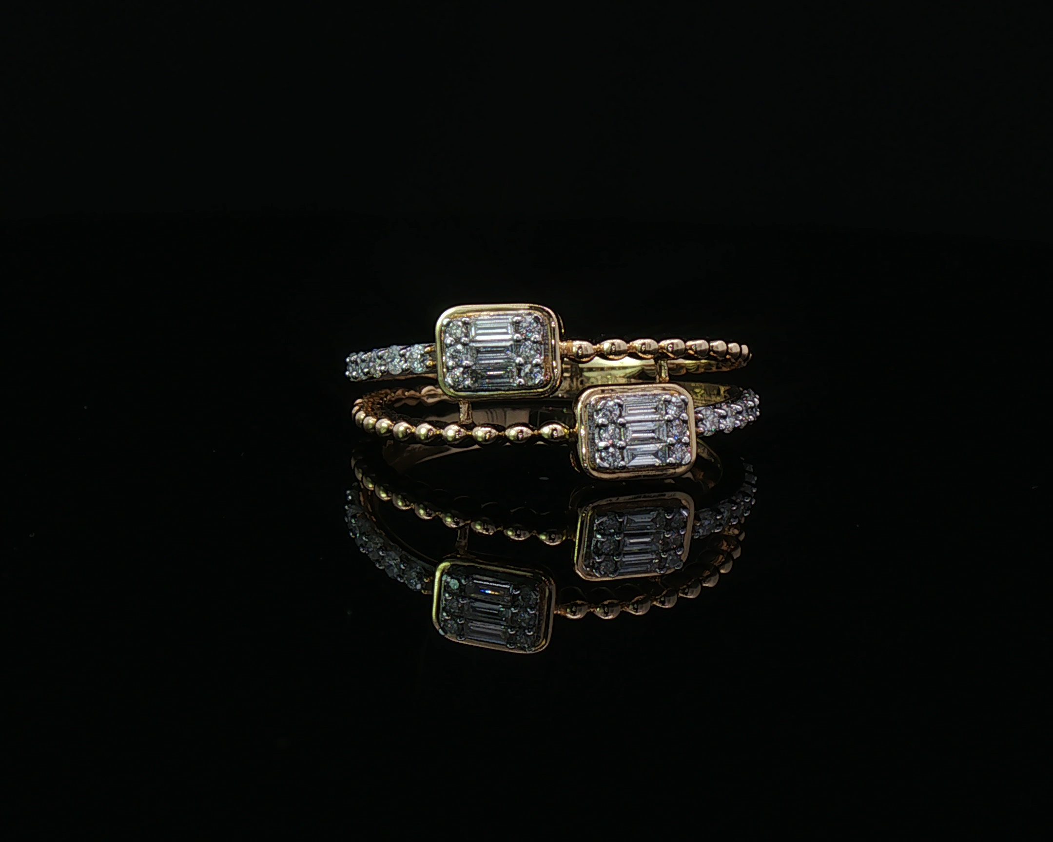 Double emerald diamond ring